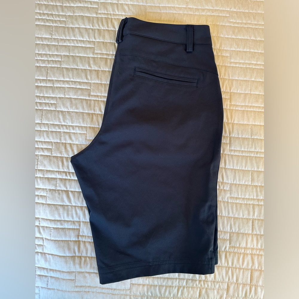 Black Puma Bermuda Golf Shorts Size 4. Zip and hook closure.